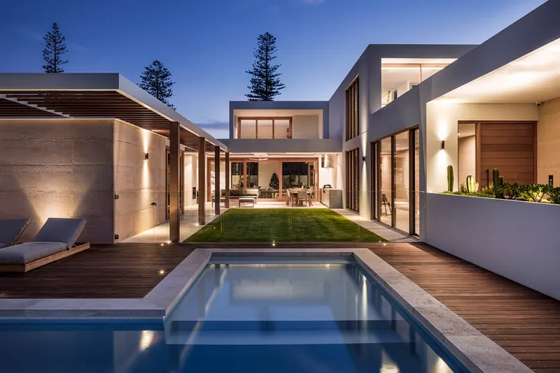 Pool courtyard and living pavilions at dusk