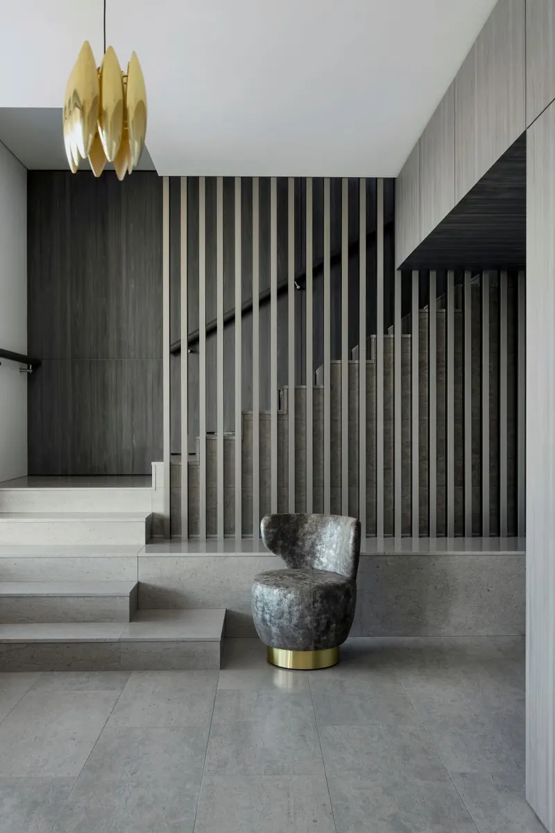 Stair with brass pendant and dark timber battens