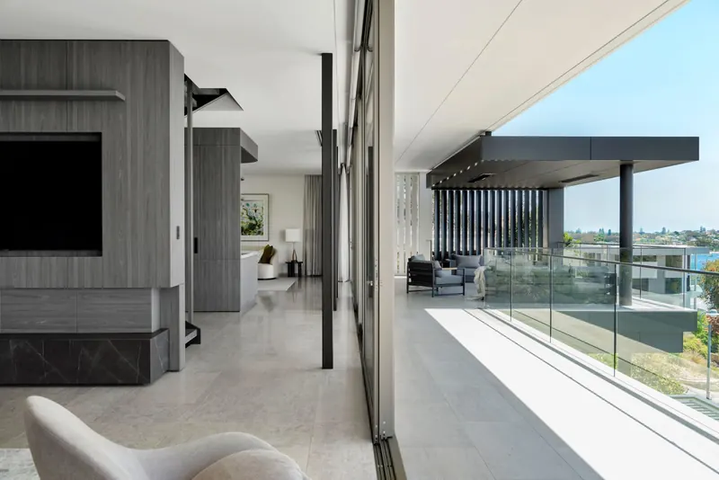Living area with glass balustrade and river views